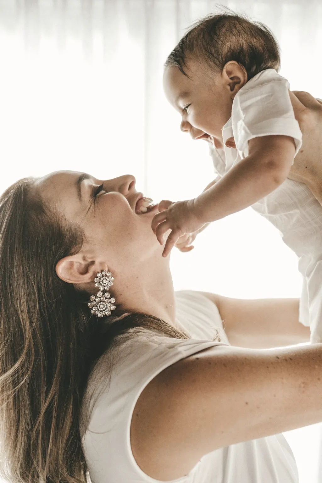 Editorial image of a mother embracing her baby