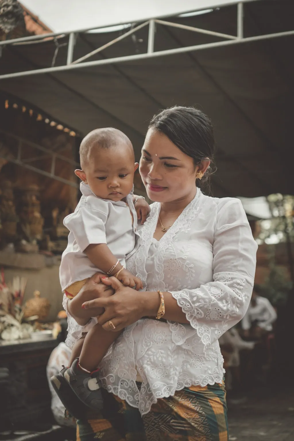 Editorial image of a mother embracing her baby