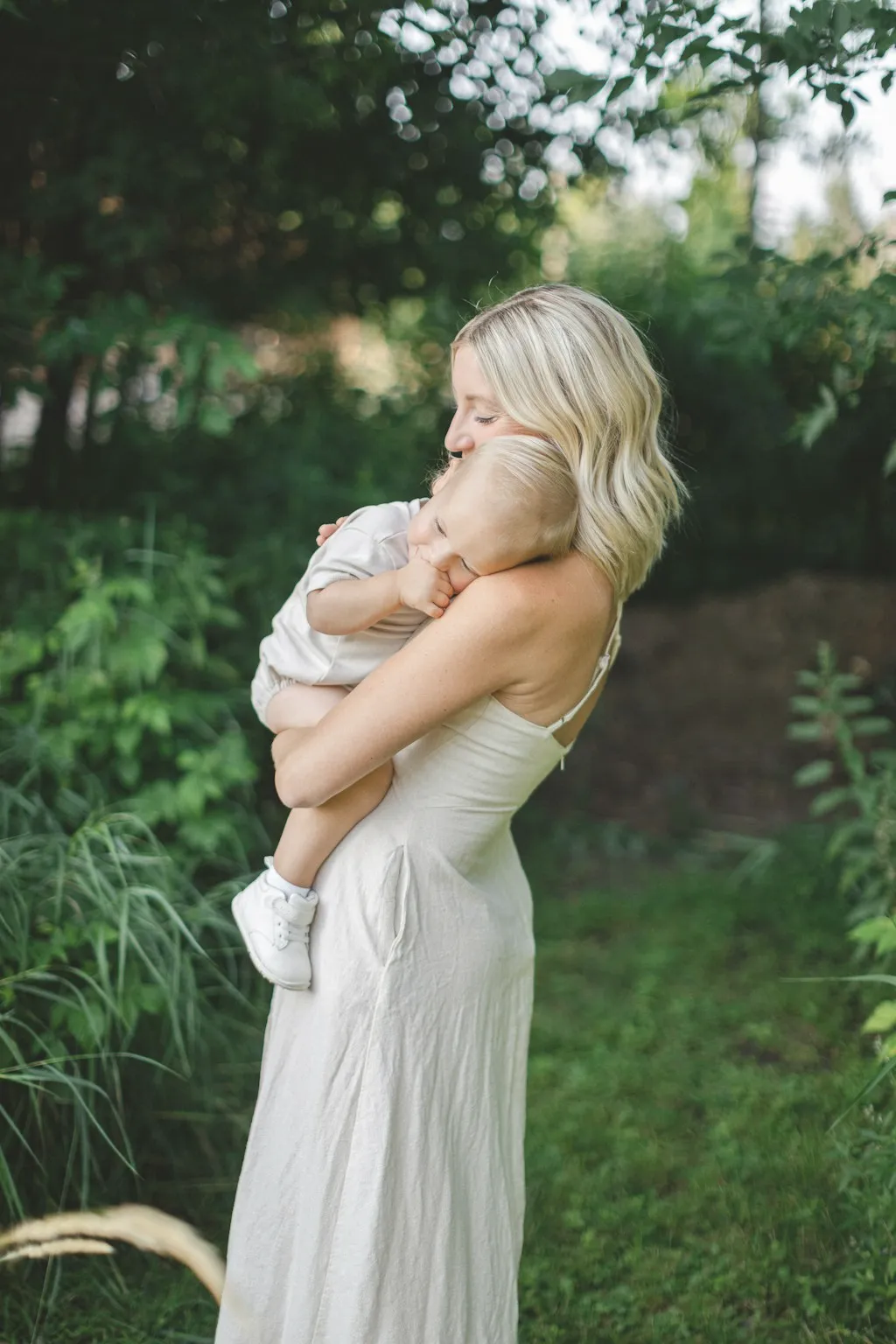 Editorial image of a mother embracing her baby